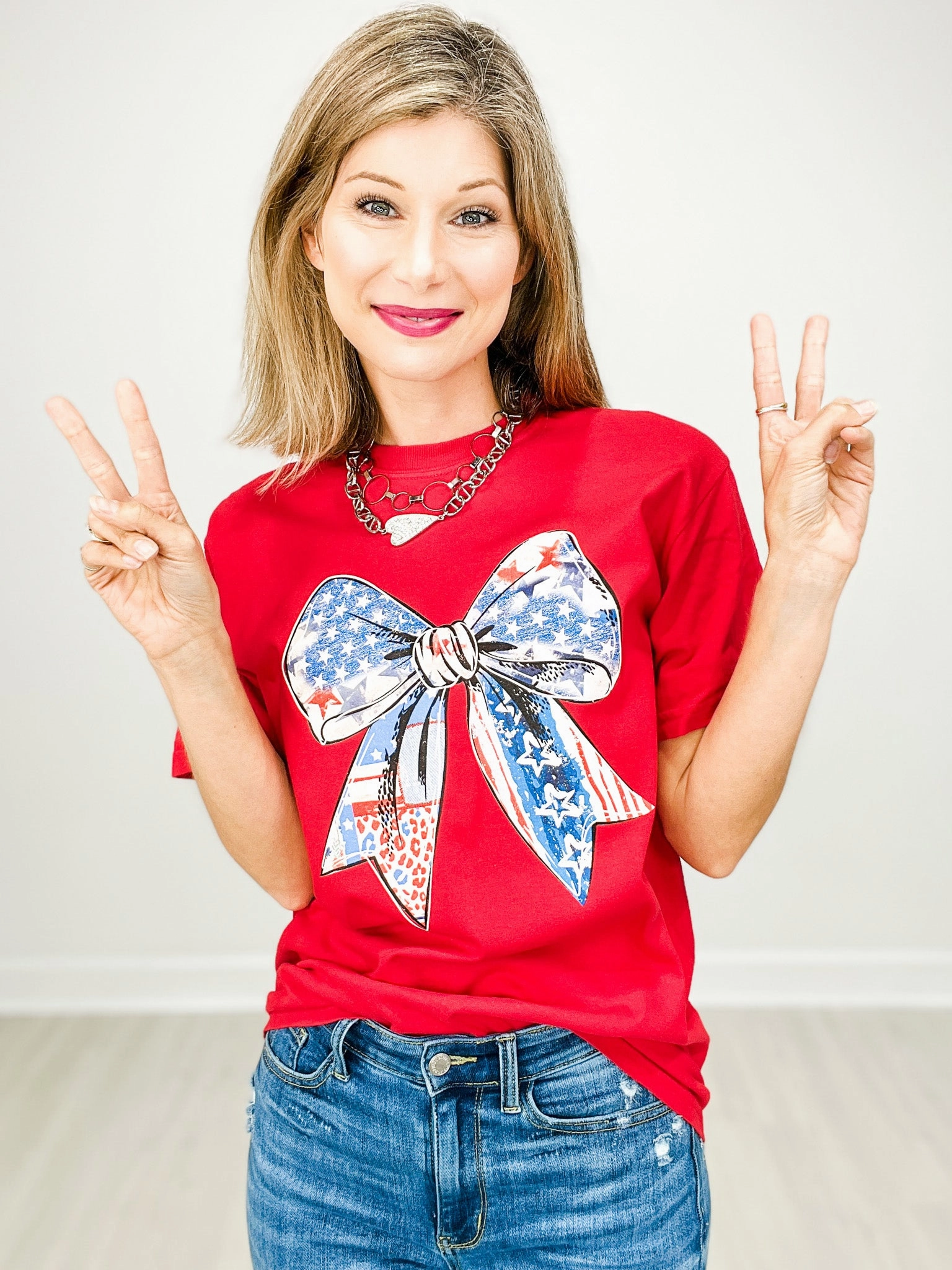Casual Long Sleeve Sustainable Production Methods Red White and Bow Graphic Tee